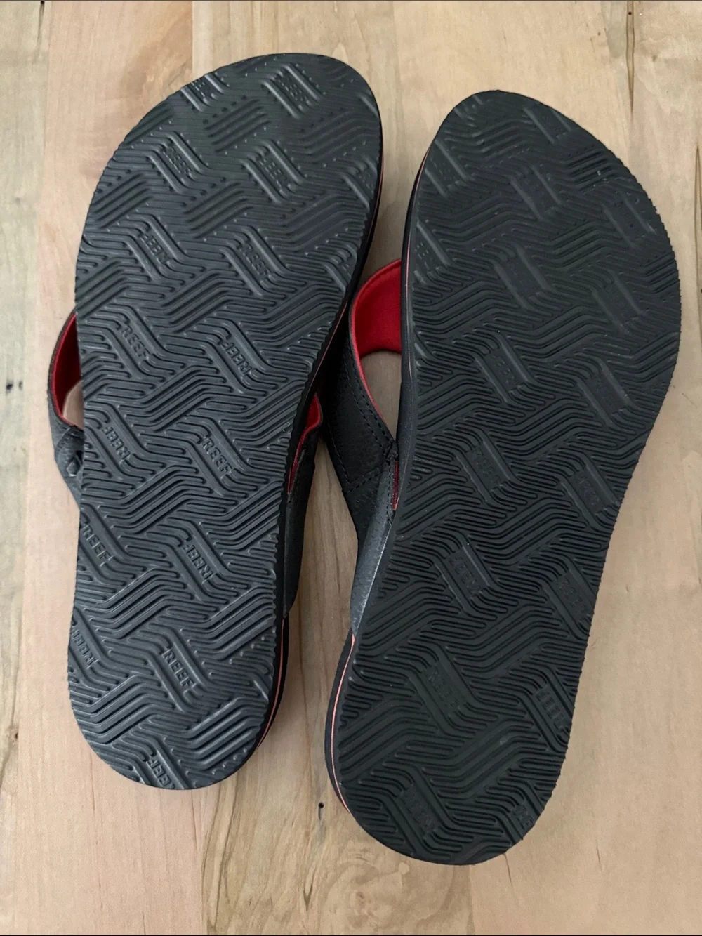Reef Black Flip Flops with Red and Yellow Graphic Print